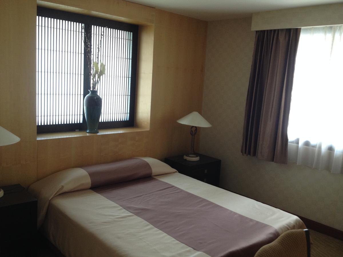 Gardengrove Suites Bangkok Habitación foto